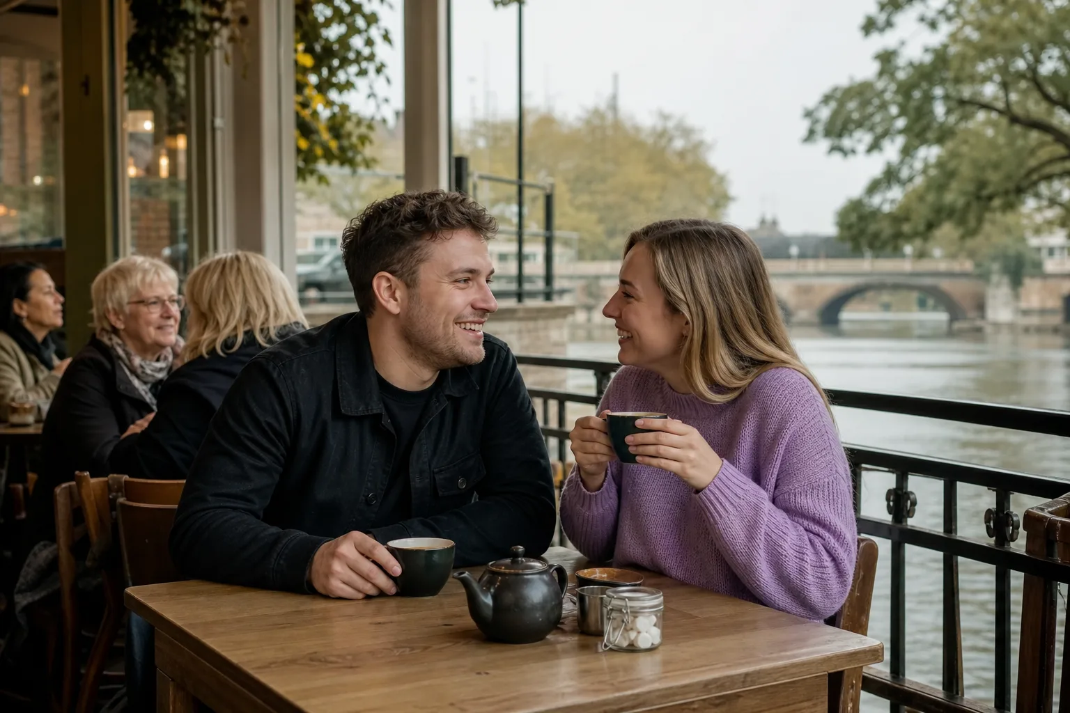 Two people talking over coffee at an independent cafe in Hertfordshire