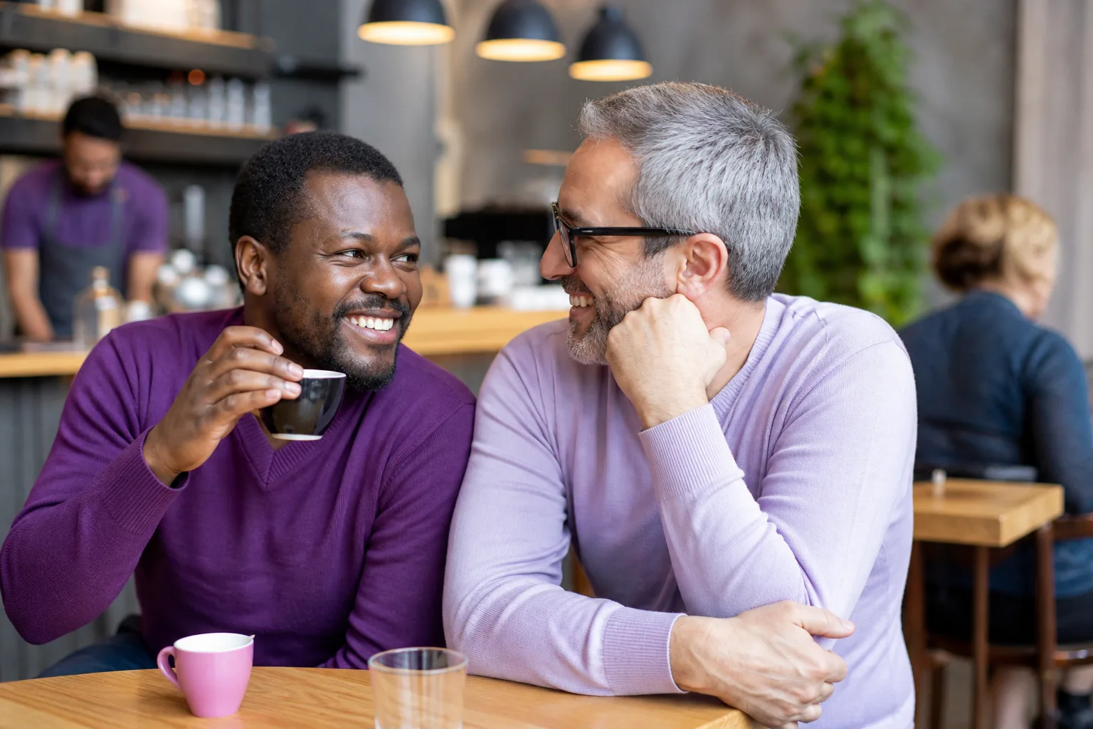 Two men enjoying a relaxed conversation in Hitchin town centre
